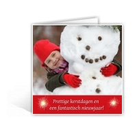Voorbeeld foto kerstkaart meisje met sneeuwpop 